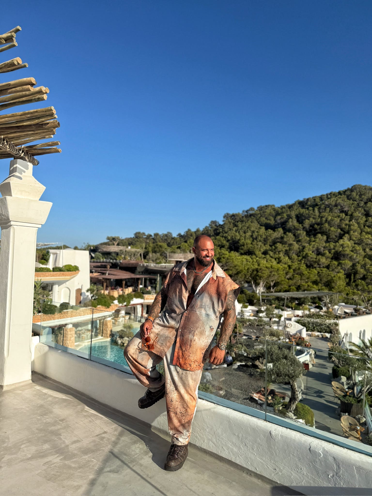 Alex Bodi on a sunlit terrace