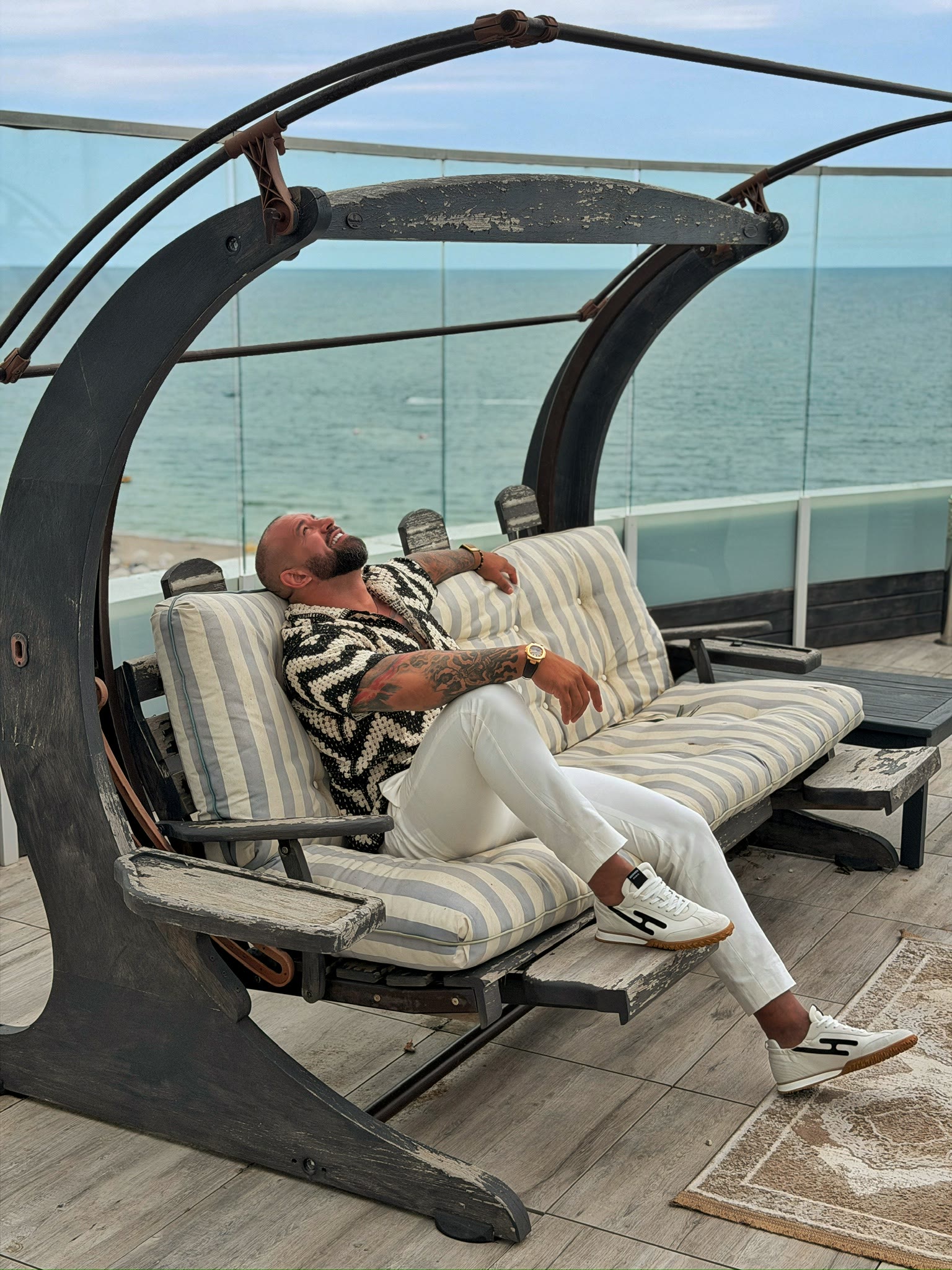 Alex Bodi relaxing above the sea