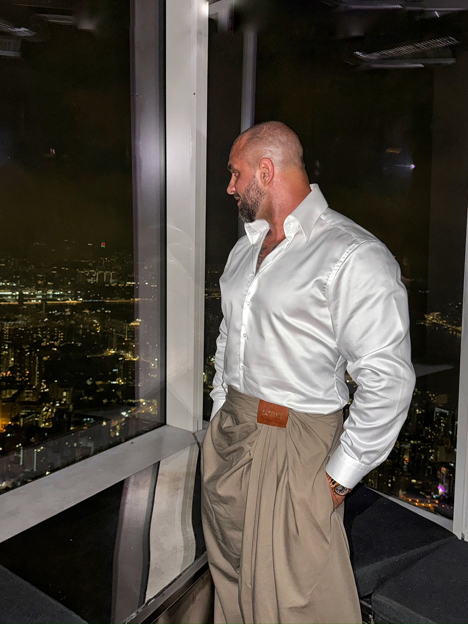 Alex Bodi overlooking a city at night