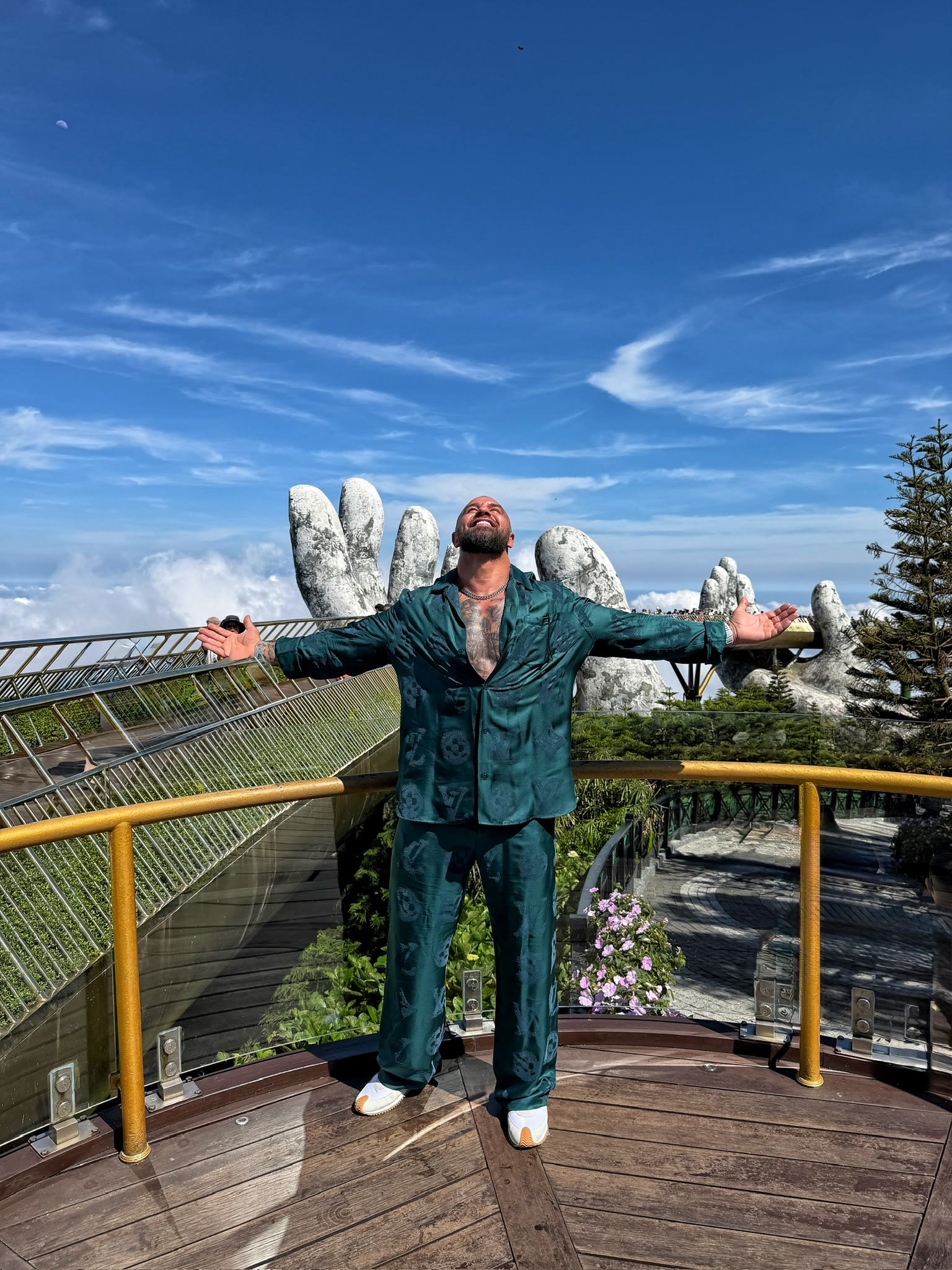 Alex Bodi posing beneath a blue sky